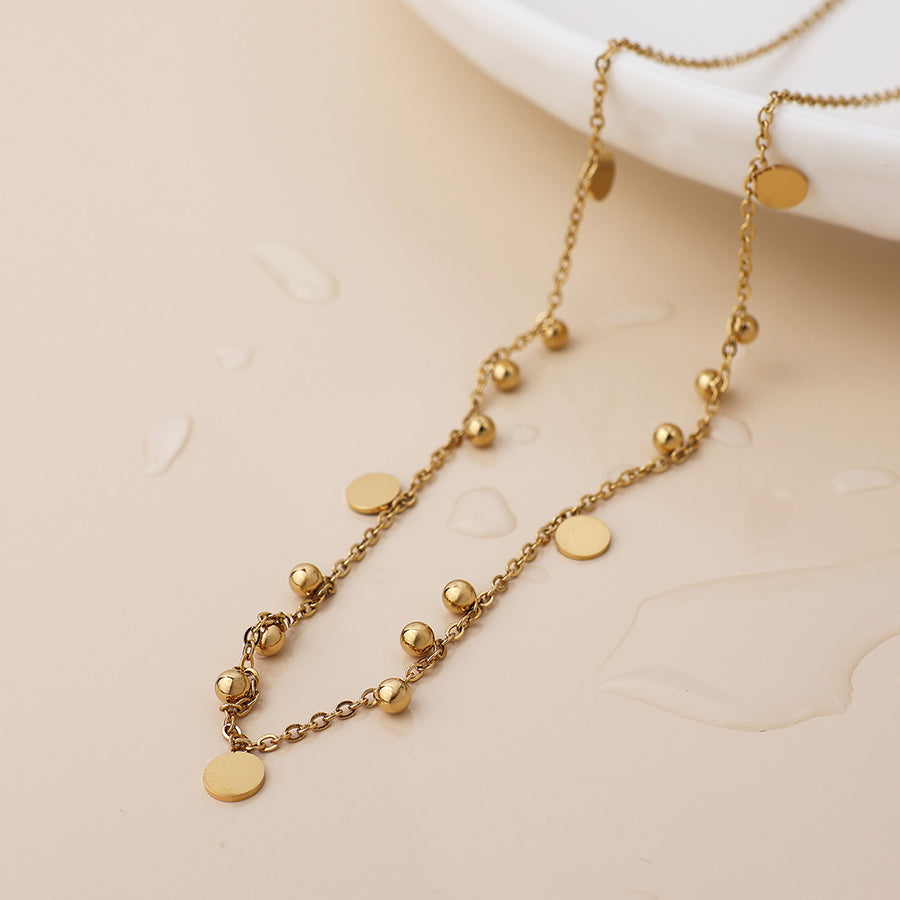 Bead and disc charm necklace
