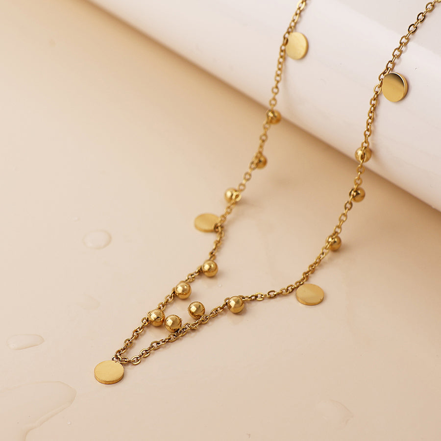 Bead and disc charm necklace