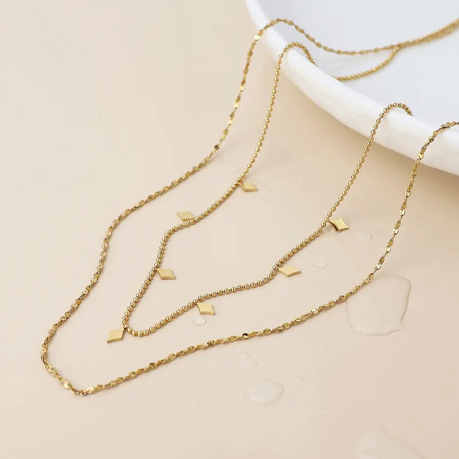 Gold layered chain and charm necklace